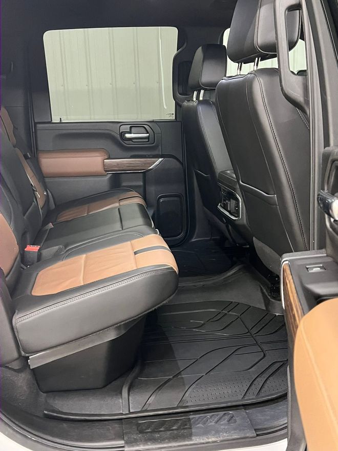 The same rear cab after detailing, with the two-tone leather bench and floor mat cleaned back to new