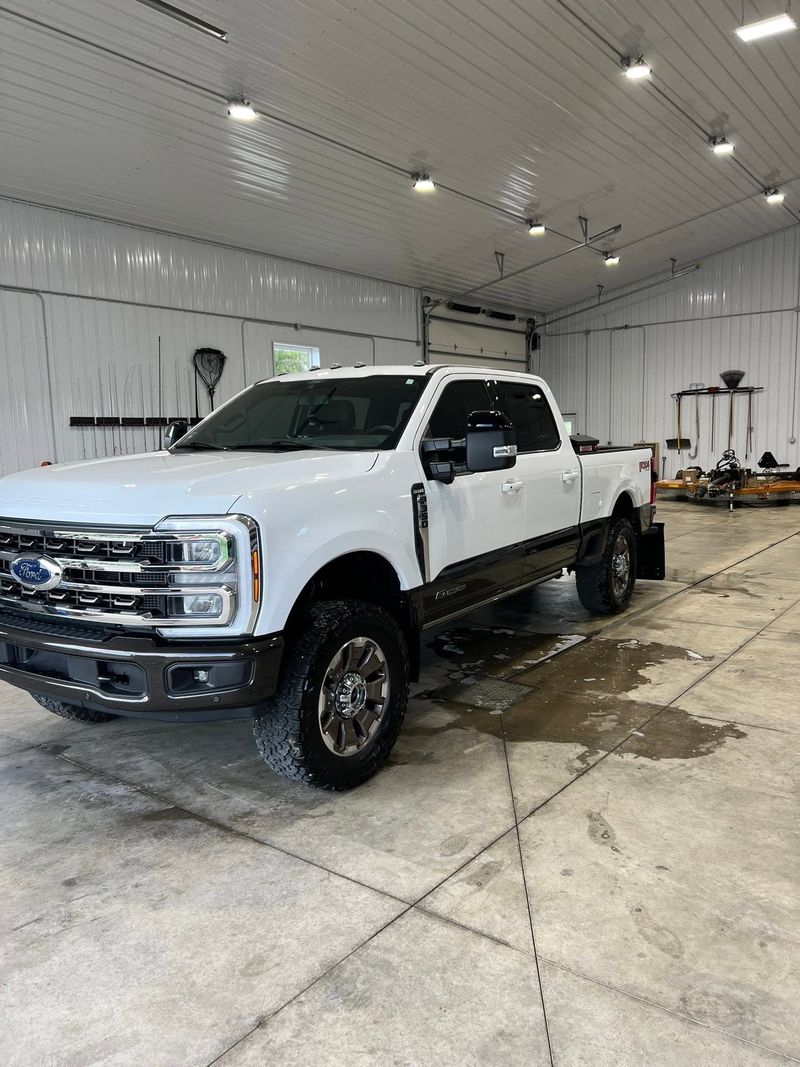 White Ford F-250 Super Duty cleaned and gleaming in a shop